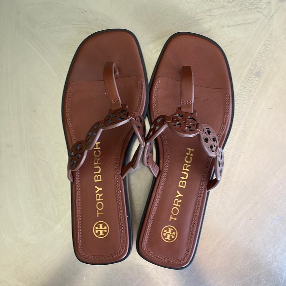 TORY BURCH, leather sandals with mini cutout logo medallions. Size 6.5